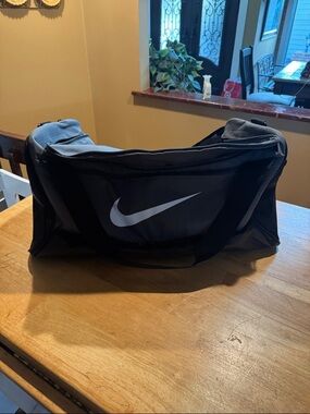 Nike Black Duffel Bag with White Swoosh